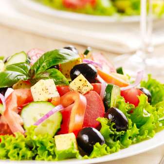 Salad Greek salad on the oak table